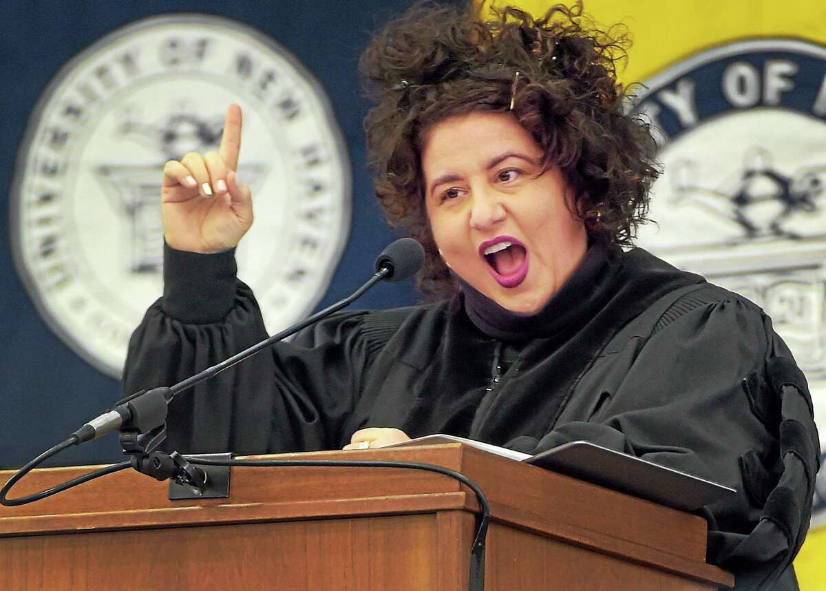 Best-selling author Adriana Trigiani makes an emphasis, jokingly, on “marrying up” during her commencement address at the University of New Haven 2015 Winter Commencement in West Haven Saturday afternoon, January 16, 2015.