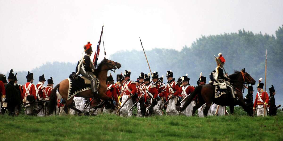 In this June 16, 2007, file photo, actors dressed as soldiers re-enact the Battle of Waterloo in Braine-l'Alleud, near Waterloo, Belgium. The Battle of Waterloo, fought on June 18, 1815, was Napoleon Bonaparte's last battle, as his defeat put a final end to his rule as Emperor of France. (AP Photo/Geert Vanden Wijngaert, File)