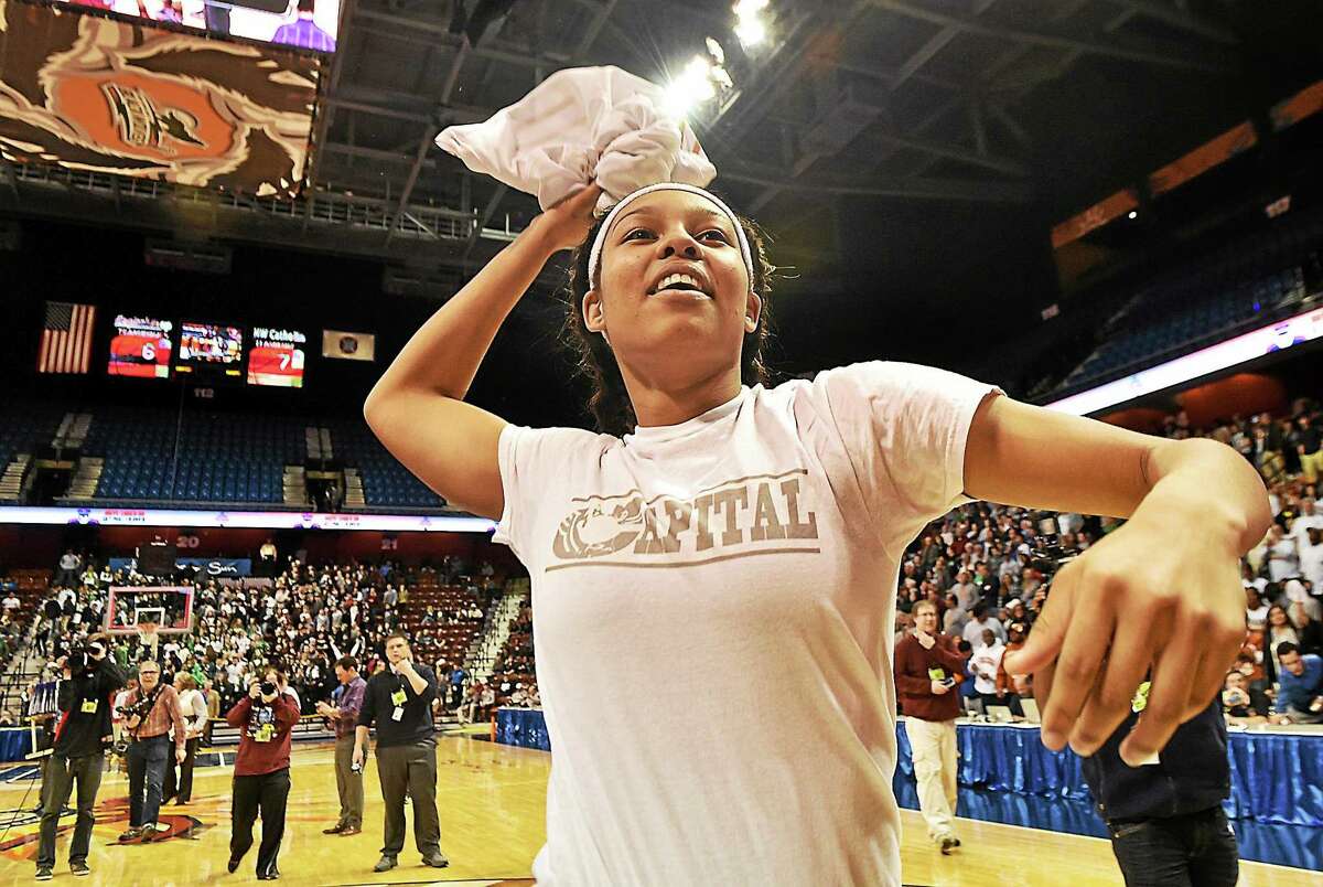 Capital Prep’s Kiah Gillespie throws her jersey into the crowd after the Trailblazers defeated Northwest Catholic for the Class L state championship on March 22 at Mohegan Sun.