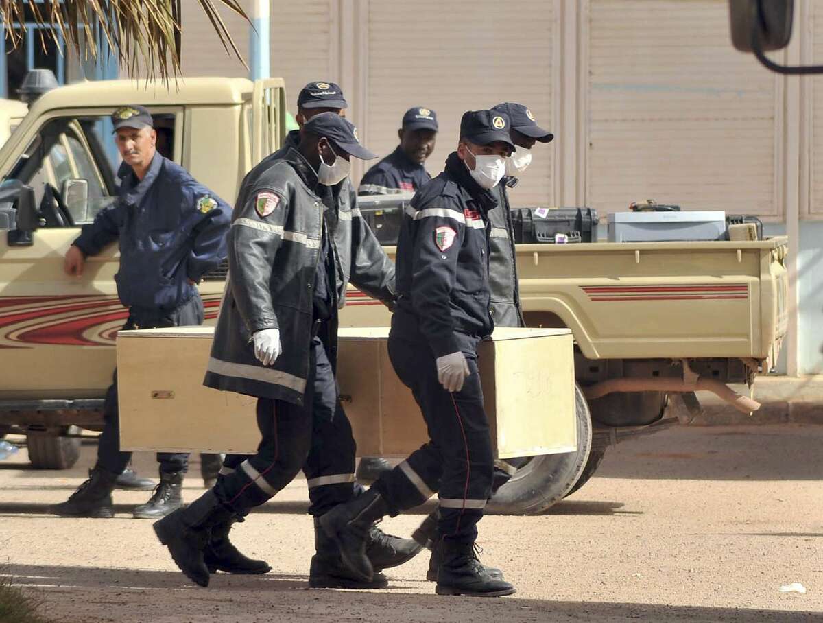 FILE PHOTO In this Jan. 21, 2013, file photo, Algerian firemen carry a coffin with the body of a person killed during the gas facility hostage situation in Ain Amenas, Algeria. The U.S. said the military launched an airstrike June 13, targeting an al-Qaida leader in eastern Libya charged with leading the attack on the gas plant.