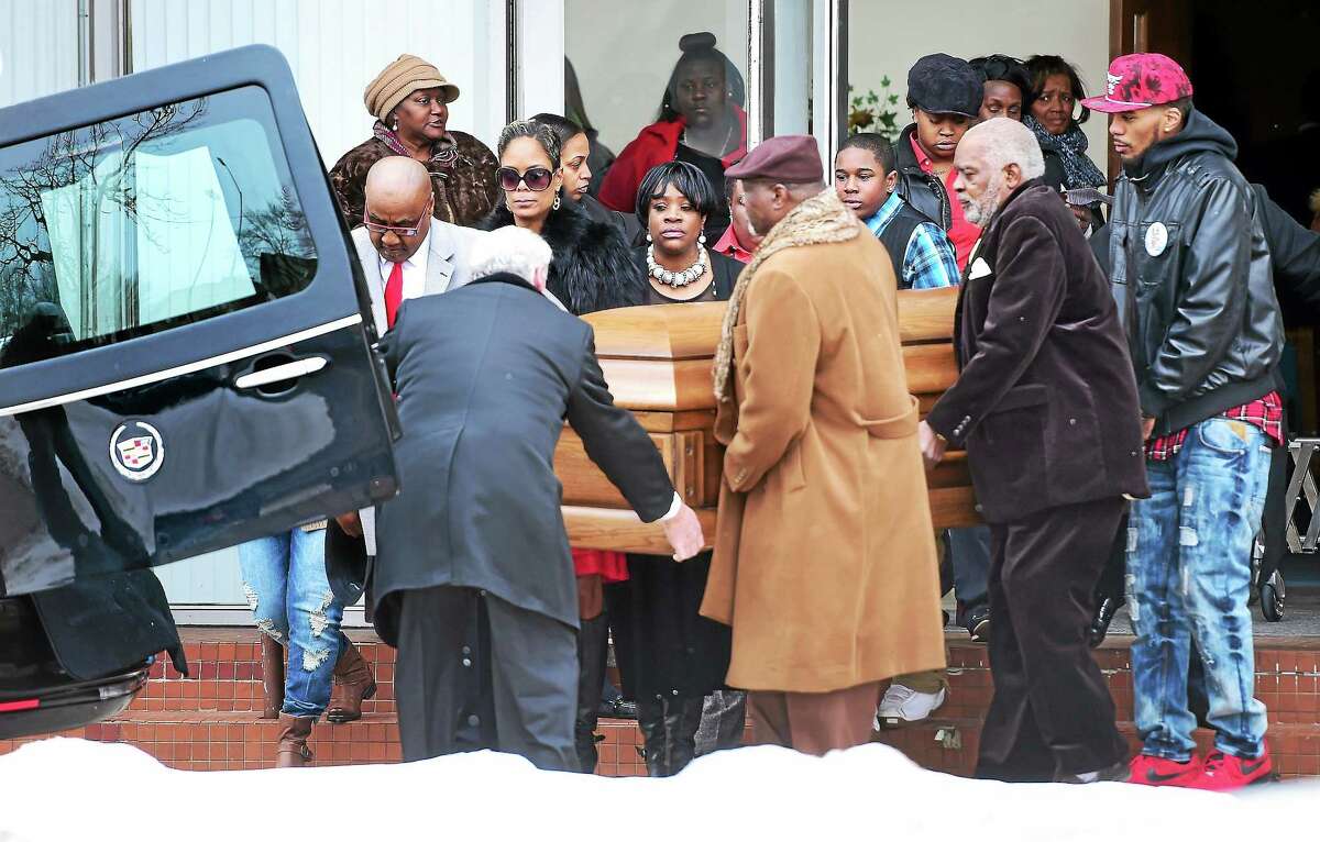 (Arnold Gold-New Haven Register) Pallbearers carry the casket of Mary Townsend from Christ Chapel New Testament Church on Dixwell Ave. in New Haven on 2/14/2015.