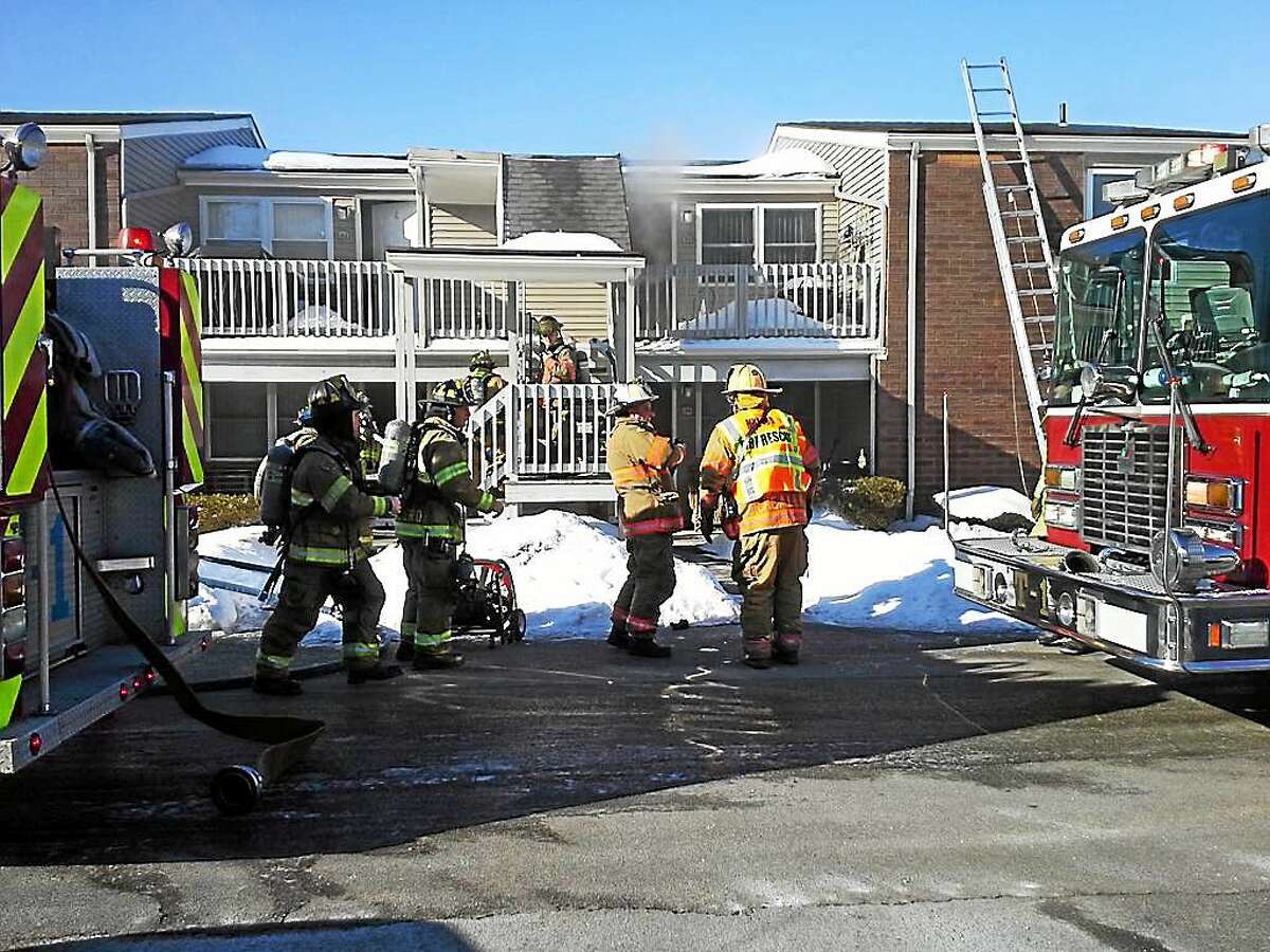 Firefighters at the scene of an apartment fire at 17 Foran Road in Milford.