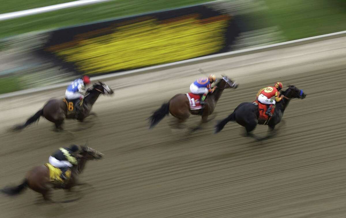 Horses run during the Gallorette Handicap ahead of the 140th Preakness Stakes Saturday at Pimlico Race Course in Baltimore.