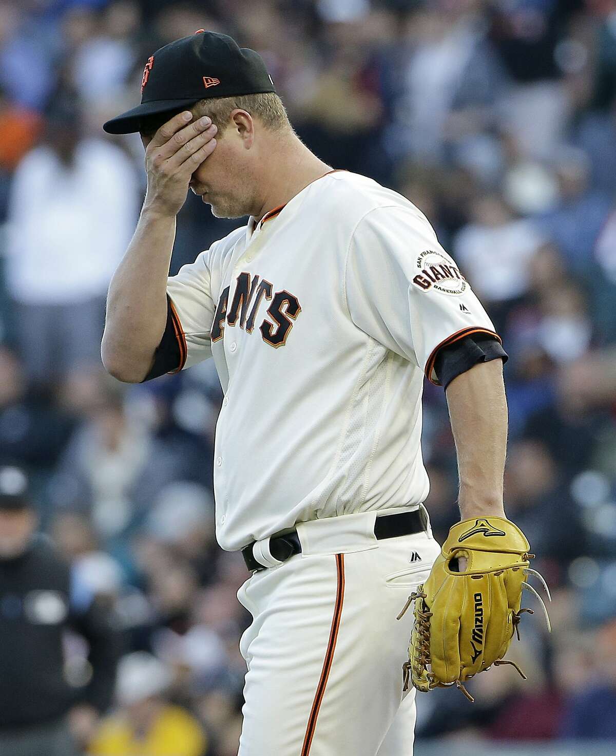 San Francisco Giants pitcher Matt Cain reacts after allowing an RBI-double to Pittsburgh Pirates' Josh Bell during the first inning of a baseball game in San Francisco, Monday, July 24, 2017. (AP Photo/Jeff Chiu)
