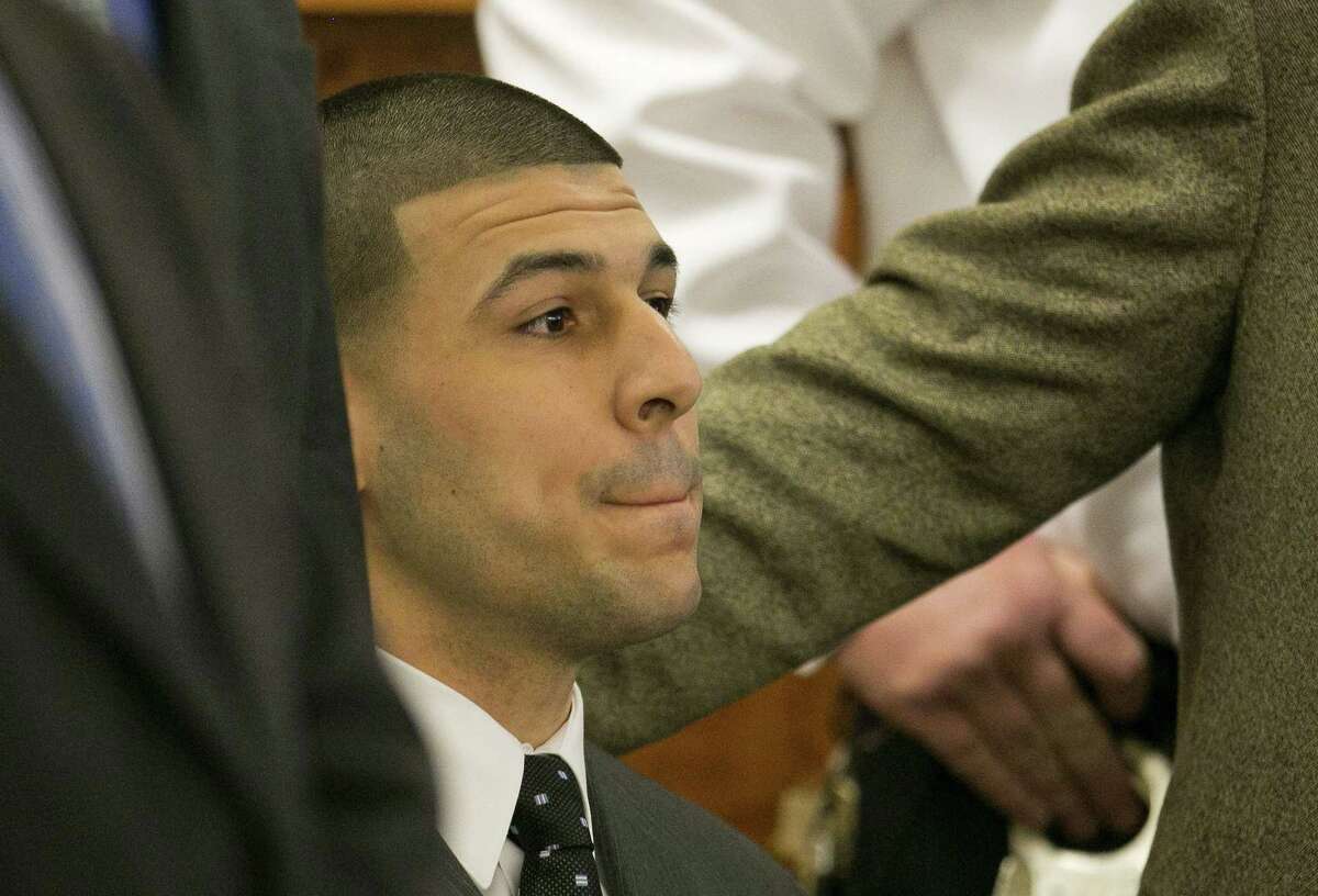 Former New England Patriots football player Aaron Hernandez listens as the guilty verdict is read during his murder trial Wednesday at Bristol County Superior Court in Fall River, Mass.