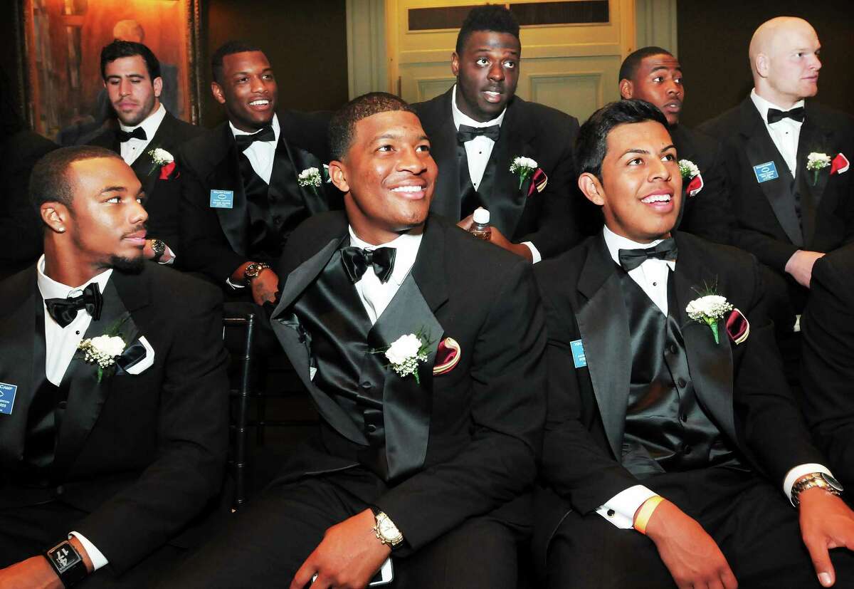 (Mara Lavitt ó New Haven Register) ¬ January 11, 2013 New Haven ¬ The 47th Annual Walter Camp National Awards dinner held at the Yale Commons. The honorees gather in the President's Room at Woolsey Hall before the banquet, from left Devon Edwards, Jace Amaro, Shilique Calhoun, Walter Camp Player of the Year Jameis Winston, Roberto Aguayo, Davante Adams, Ka'deem Carey and Trent Murphy.