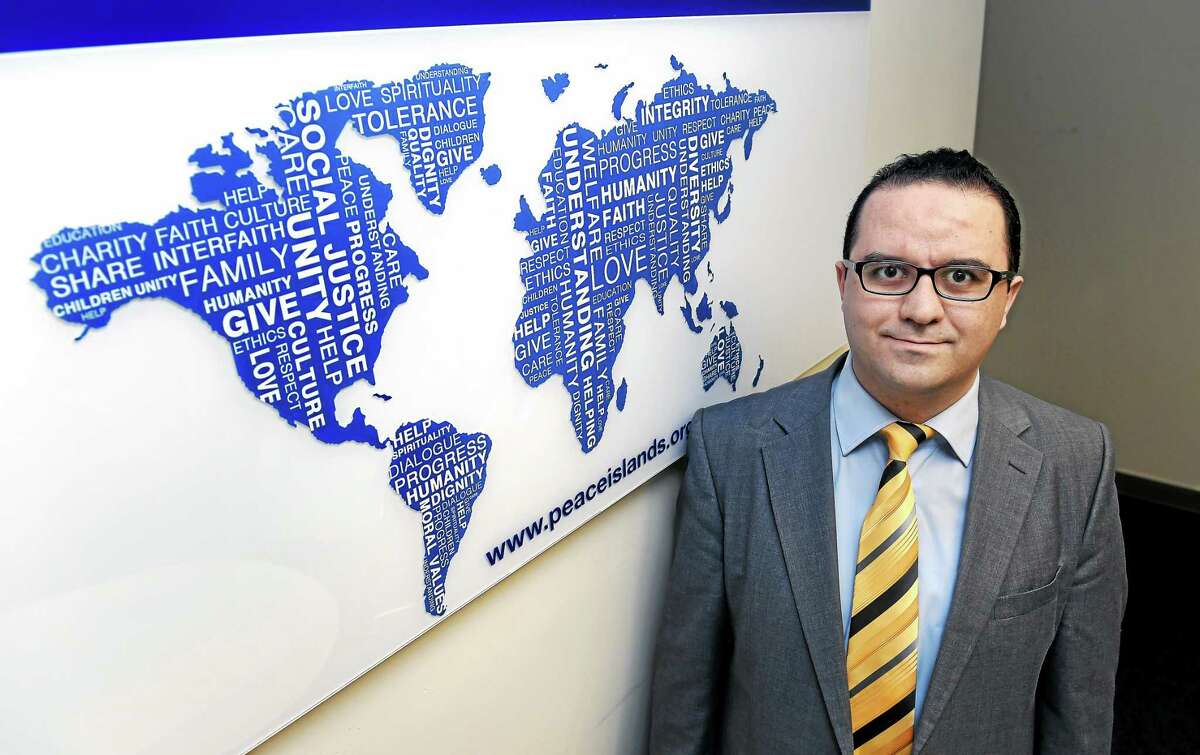 (Arnold Gold-New Haven Register) Mehmet Erdogdu, Director of the Connecticut chapter of the Peace Islands Institute, is photographed in the New Haven office on 3/10/2015.