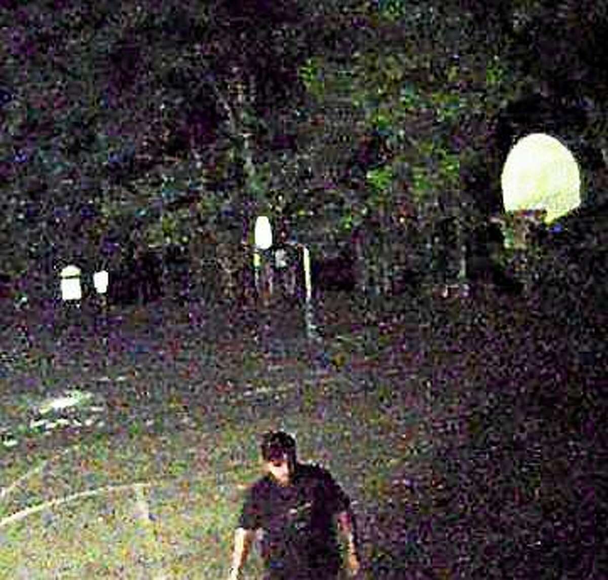Police in Orange are investigating after someone spray painted “DX” and male genitalia around the campus at Race Brook School. Police say this man was captured on camera walking across the campus early Friday. Photo courtesy of the Orange Police Department.