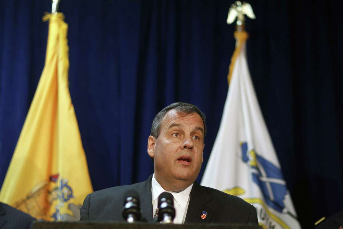 In this April 8, 2015 photo, New Jersey Gov. Chris Christie addresses a gathering as he announces a $202 million flood control project for Union Beach in Union Beach, N.J.