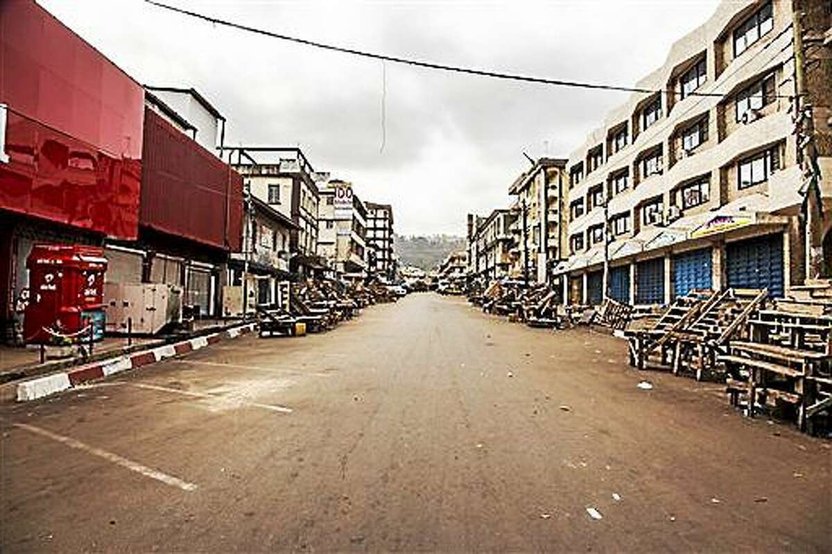 FILE - In this file photo dated Friday, March. 27, 2015, a usually busy street is deserted as Sierra Leone enters a three day country wide lockdown on movement of people due to the Ebola virus in the city of Freetown, Sierra Leone. Sierra Leone’s 6 million people were told to stay home for three days, except for religious services, beginning Friday as the West African nation attempted a final push to rid itself of Ebola.