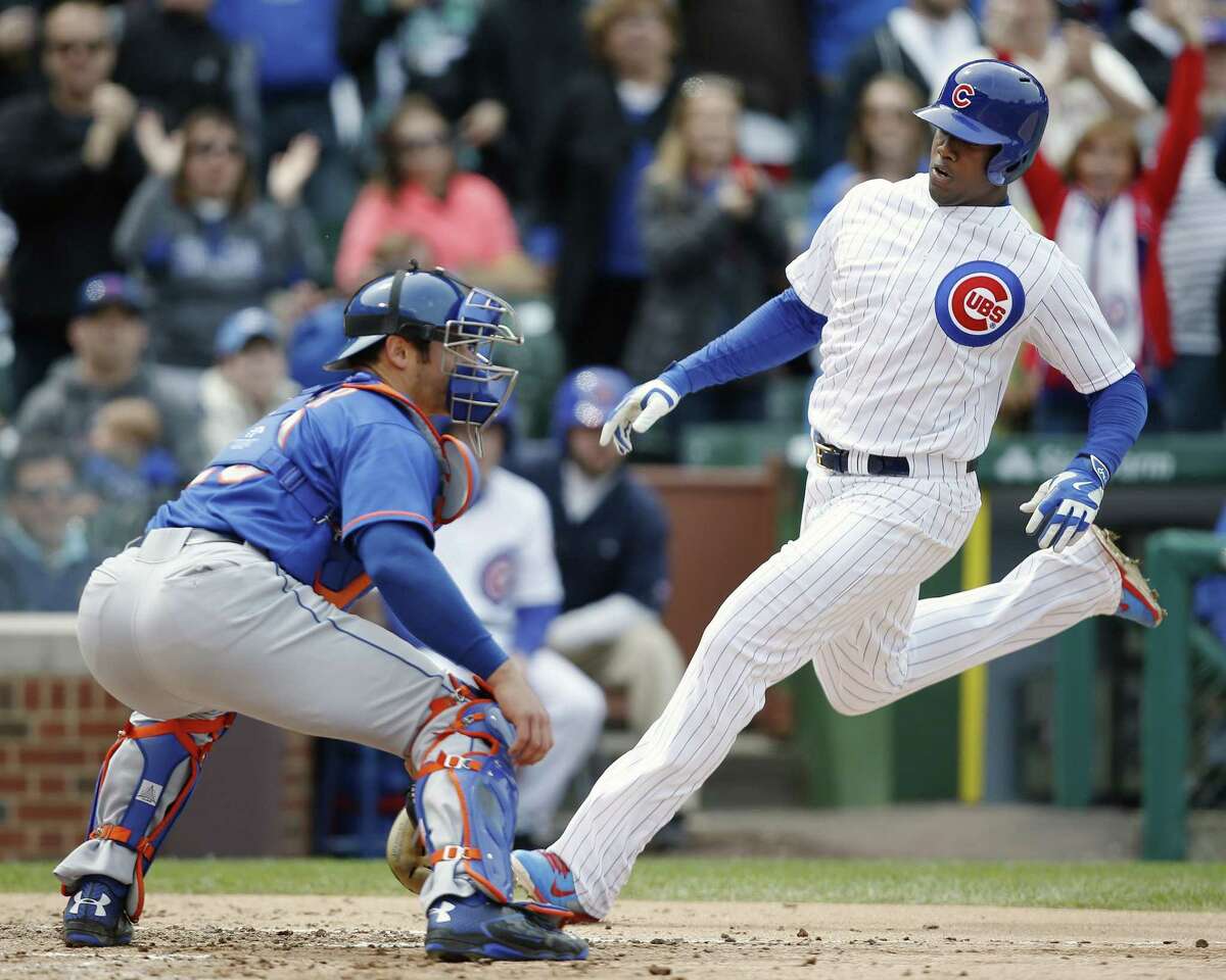 The Cubs’ Jorge Soler scores past Mets catcher Anthony Recker in the fifth inning on Thursday.