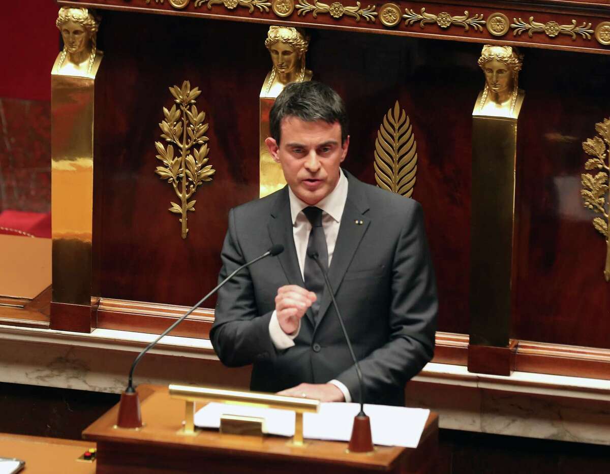 French prime minister Manuel Valls delivers his speech during an homage to the 17 victims of last week terrorist attacks, at the French national Assembly in Paris, Tuesday Jan. 13, 2015. (AP Photo/Remy de la Mauviniere)