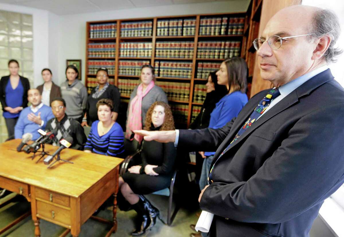 Attorney Alphonse Gerhardstein, right, during a news conference in Cincinnati with several gay couples he is representing in a federal civil rights lawsuit over gay marriage rights in this 2014 archive photograph.