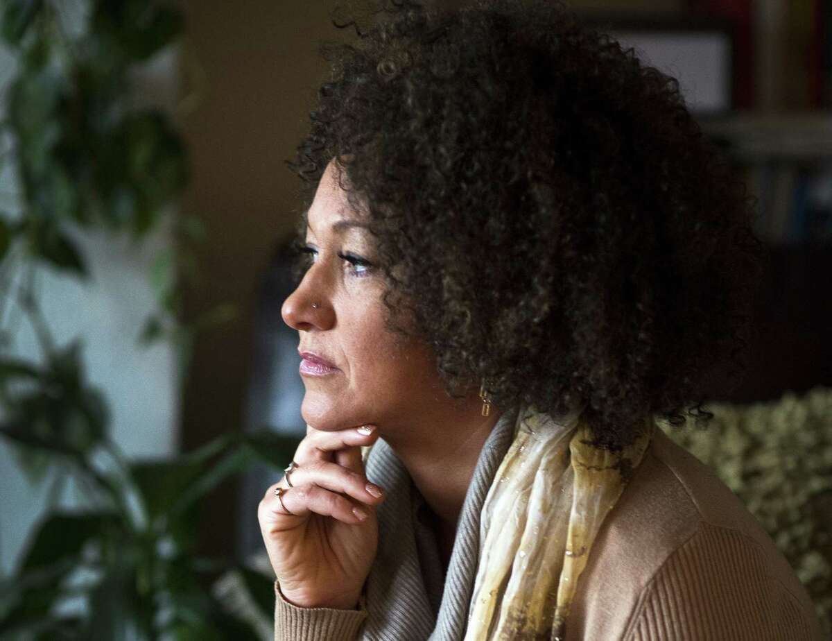 FILE- In this March 2, 2015 file photo, Rachel Dolezal, president of the Spokane chapter of the NAACP, poses for a photo in her Spokane, Wash. home. Dolezal is facing questions about whether she lied about her racial identity, with her family saying she is white but has portrayed herself as black, Friday, June 12, 2015. (Colin Mulvany/The Spokesman-Review via AP, File) COEUR D'ALENE PRESS OUT