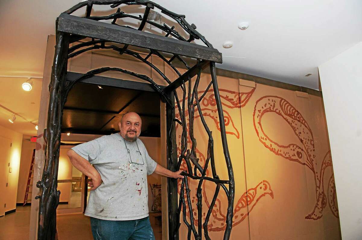 Artist Robert Barsamian at the exhibit he was installing at Southern Connecticut State University Monday.
