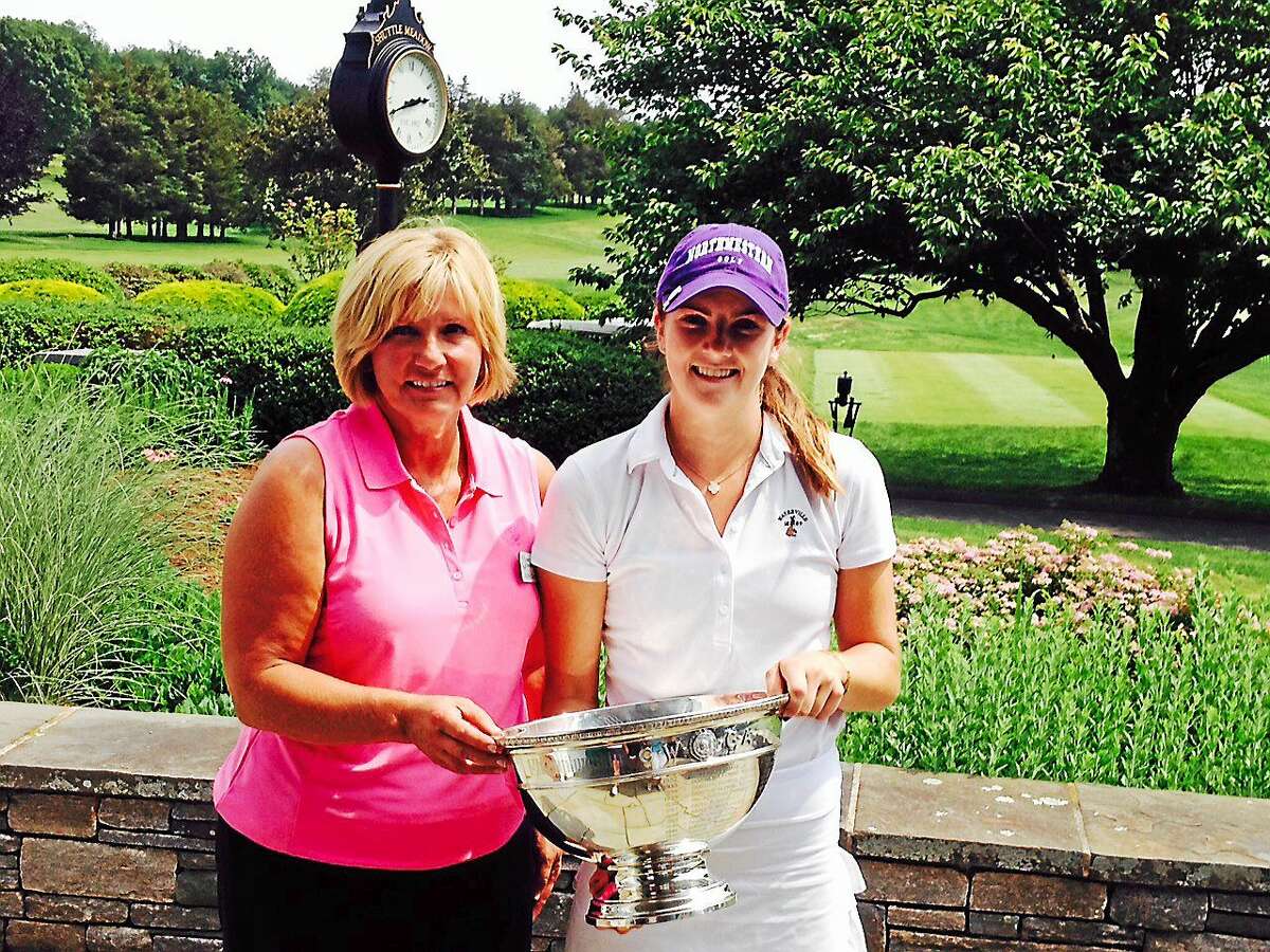 Joe Morelli/Register Mackenzie Hawkes of Madison won her second straight CWGA championship Friday. Michele Dreiss from the CWGA hands Hawkes the trophy.