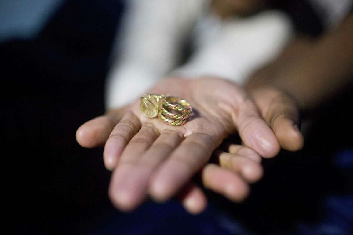 Tori Sisson holds out her and ShantÈ Wolfe’s wedding rings inside their tent near the Montgomery County Courthouse on Feb. 8, 2015 in Montgomery, Ala.