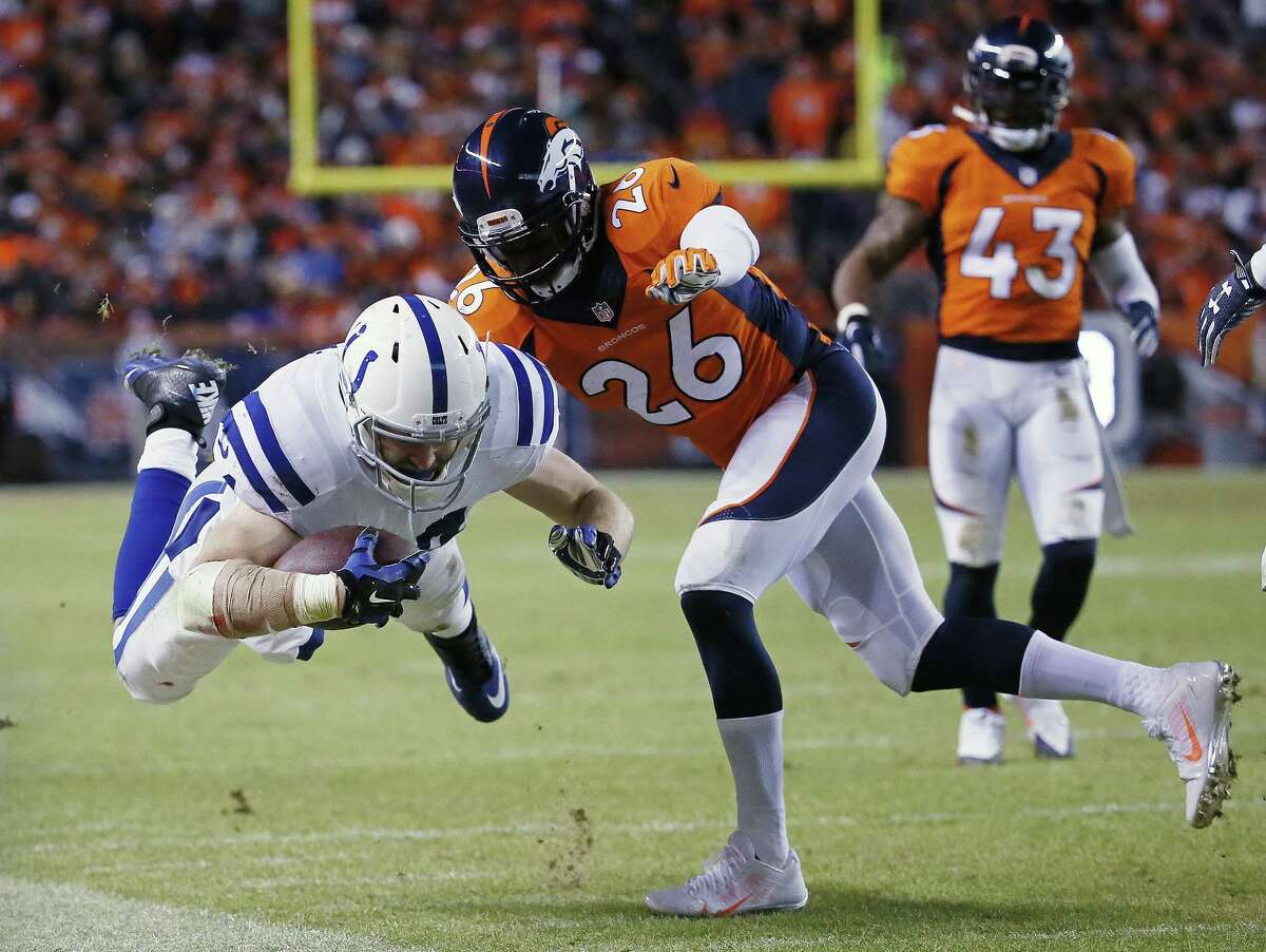 Colts running back Ahmad Bradshaw is knocked out of bounds during the second half Sunday.