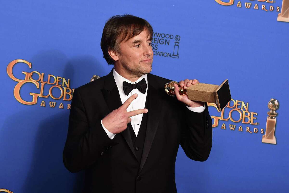 Richard Linklater poses in the press room with the award for best director for ìBoyhoodî at the 72nd annual Golden Globe Awards at the Beverly Hilton Hotel on Sunday, Jan. 11, 2015, in Beverly Hills, Calif.