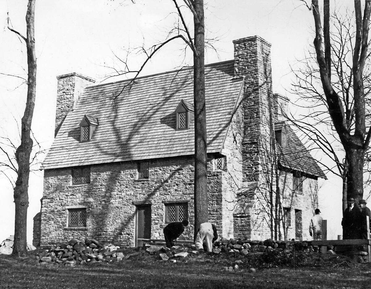 Workers rebuild the stone walls at the Henry Whitfield State Museum, 1937.