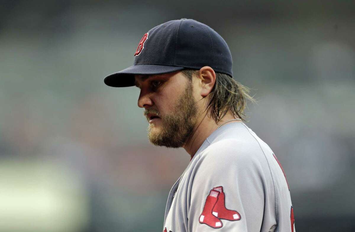 Red Sox starting pitcher Wade Miley walks off the field after the third inning Thursday.