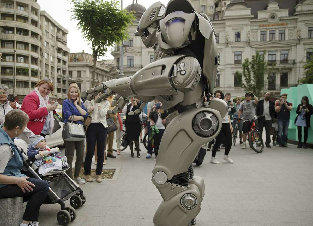 A child looks up at Titan the Robot in Bucharest, Romania on May 11, 2015.