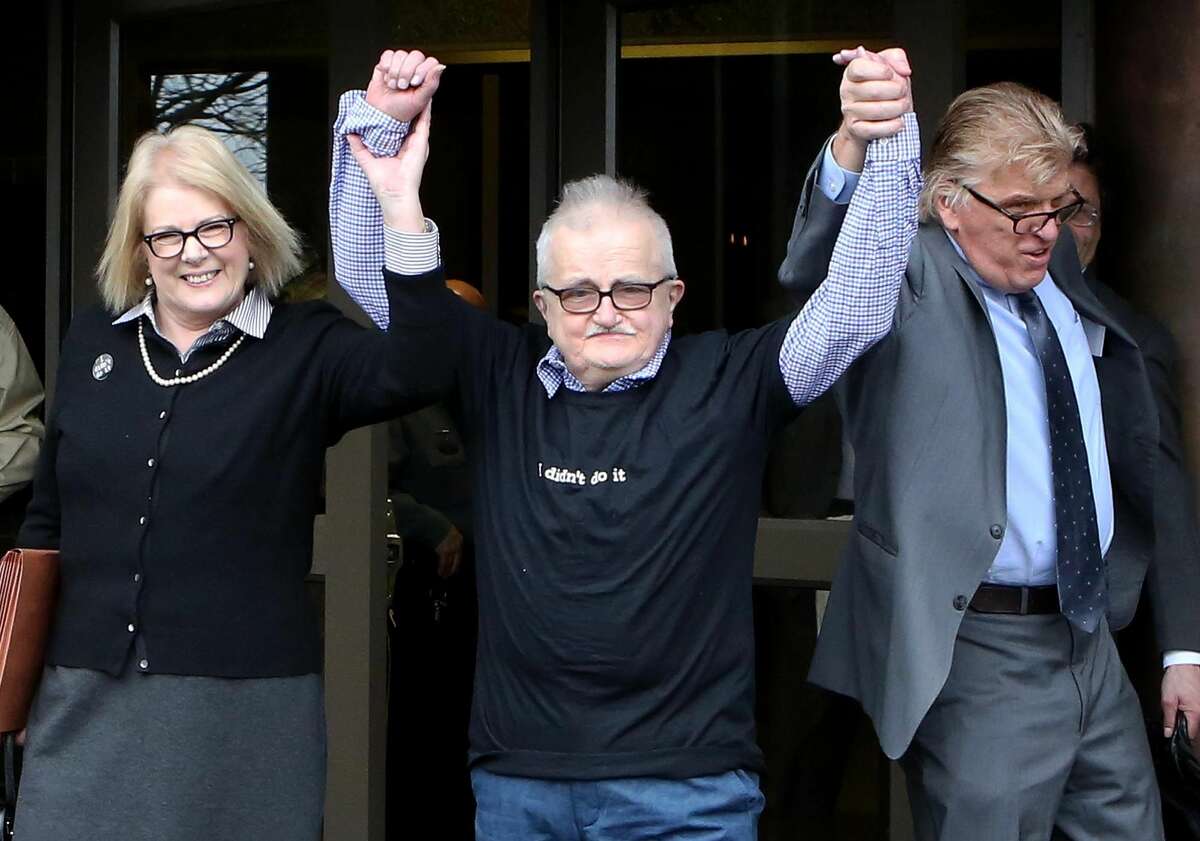 Richard Lapointe, center, raises his arms with Kate Germond, left, Centurion Ministries Co-Director, and Paul Casteleiro, right, Centurion Ministries Legal Director, after he was granted bail and released Friday at the Connecticut Supreme Court in Hartford.