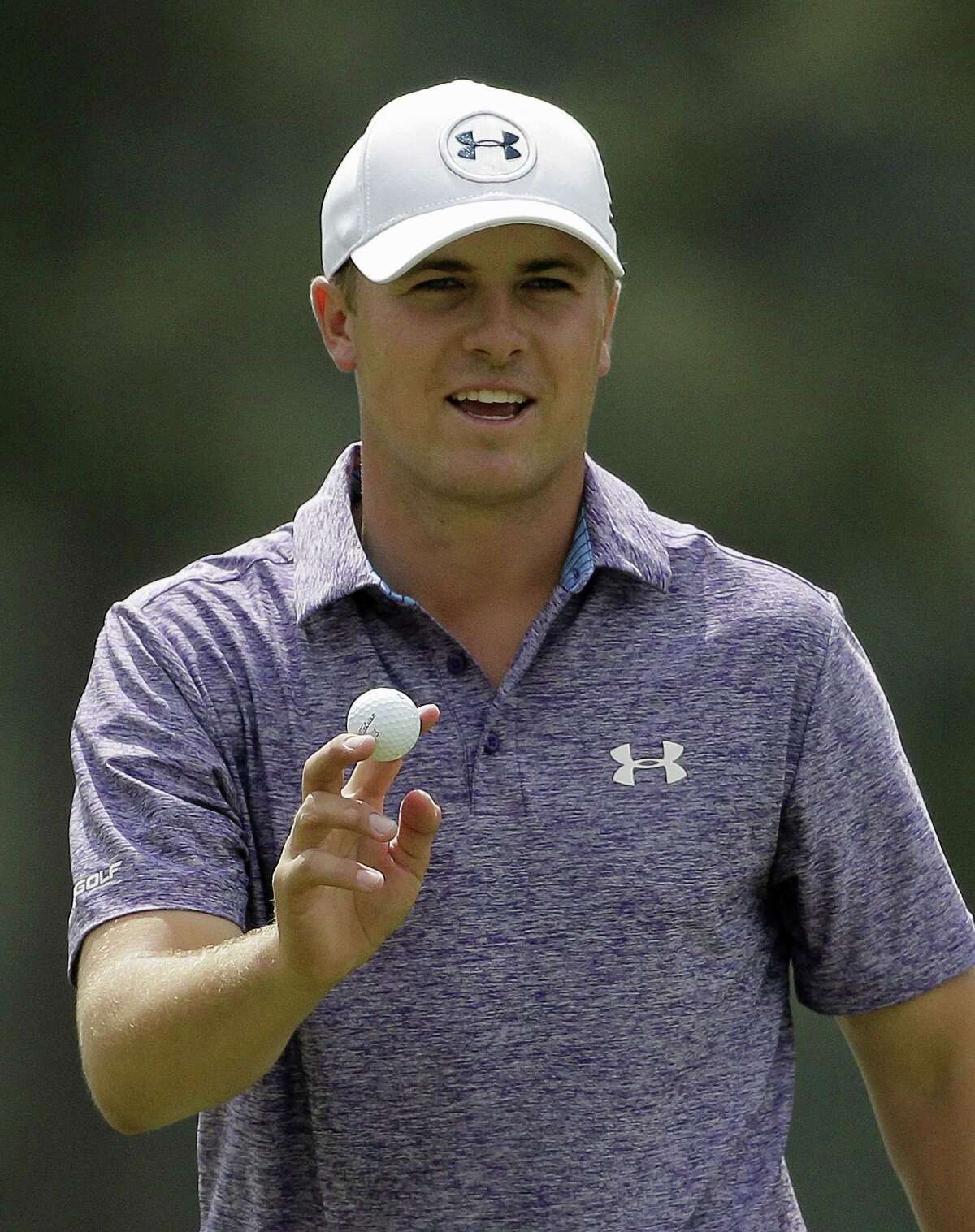 Jordan Spieth holds up his ball after a biride on the eighth hole during the second round of the Masters golf tournament Friday, April 10, 2015, in Augusta, Ga. (AP Photo/Chris Carlson)