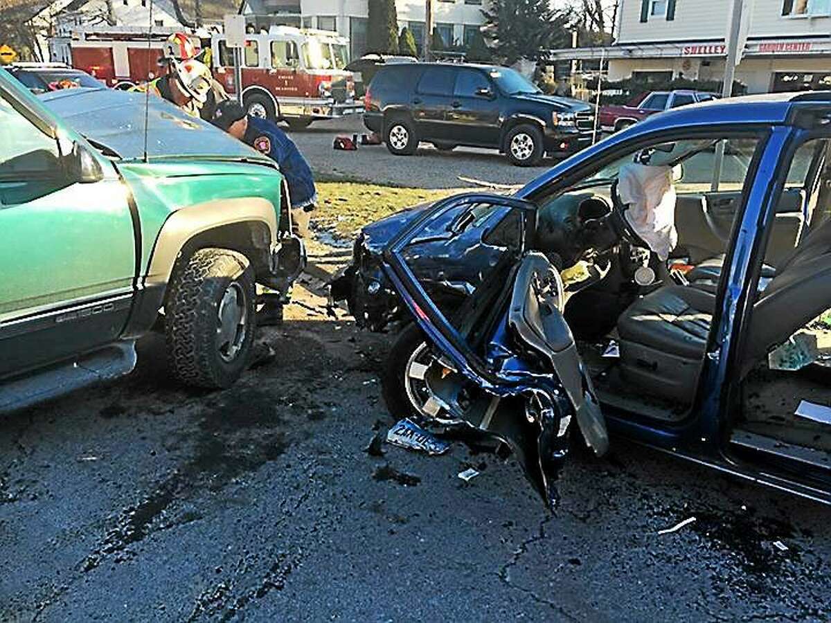 Two people were injured and a woman had to be cut from her vehicle with the Jaws of Life after a crash Thursday afternoon in Branford.
