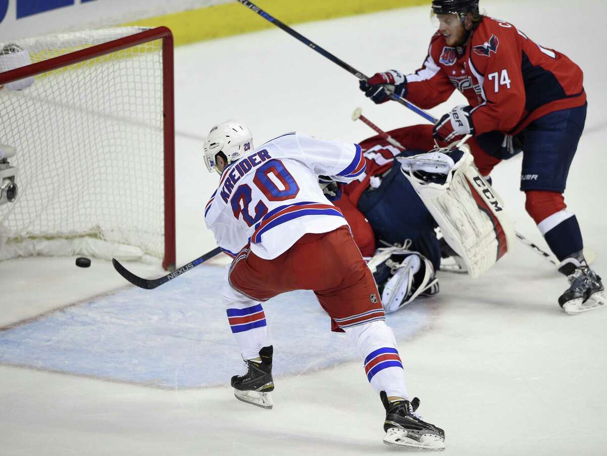Rangers left wing Chris Kreider scores his second goal of the first period past Washington Capitals goalie Braden Holtby on Sunday.