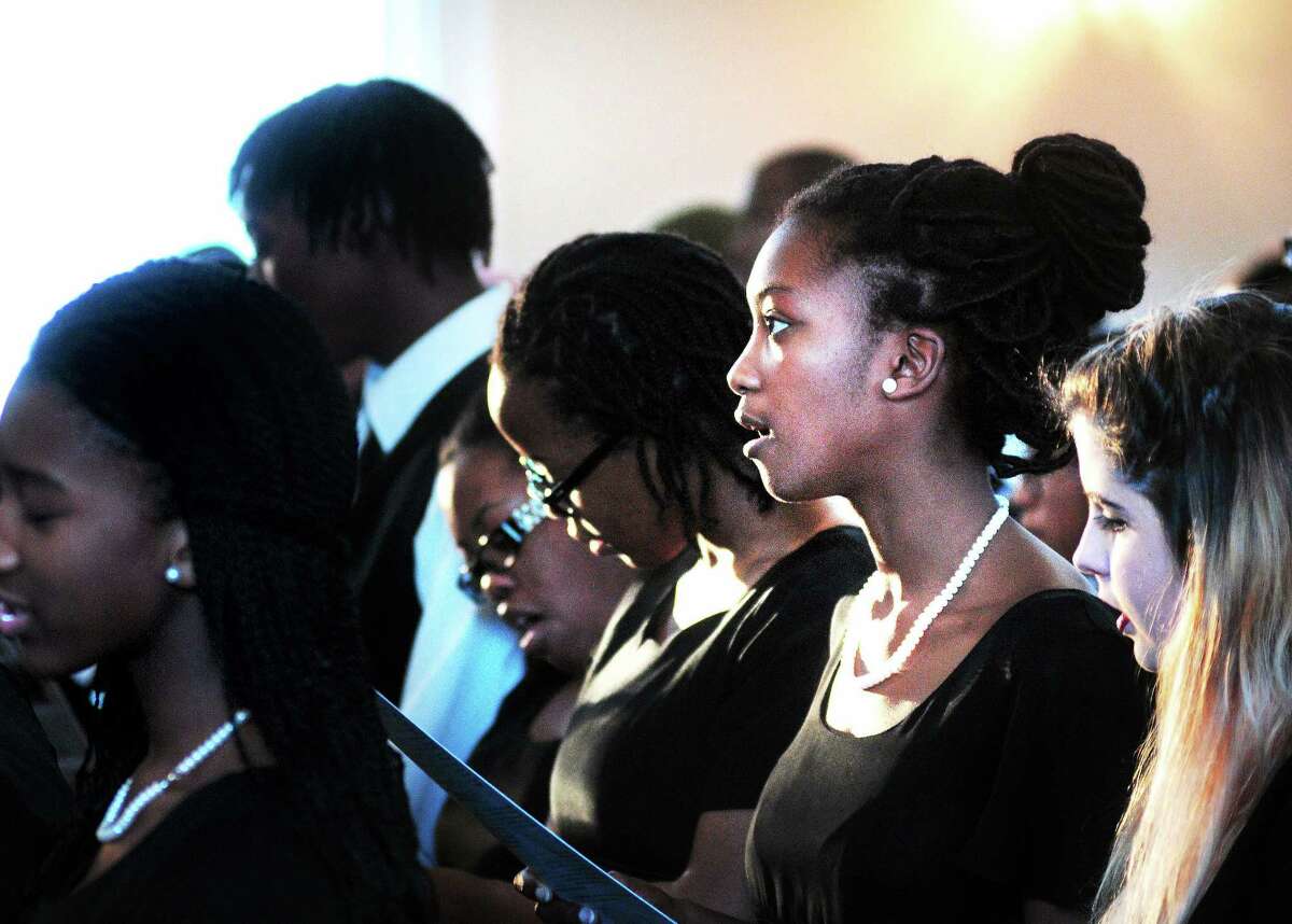 West Haven High School Choir alumnus Josephine Ankrah, second from right, sings with the choir during the West Haven Black Coalition’s annual tribute to The Rev. Martin Luther King Jr., at the First Congregational Church in West Haven in 2014.