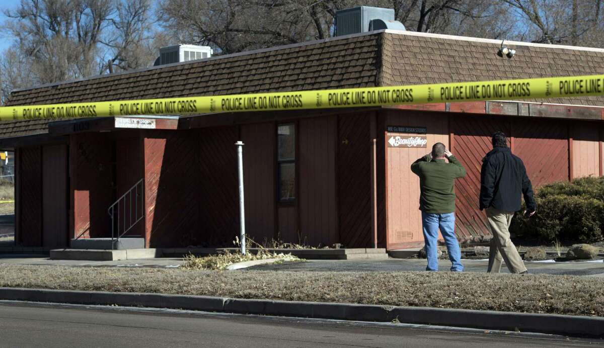 Colorado Springs police officers investigate the scene of an explosion Tuesday, Jan. 6, 2015, at Mr. G’s Hair Salon at 603 S. El Paso Street in Colorado Springs, Colo.