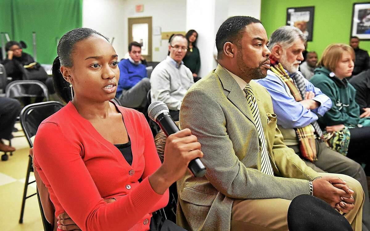 University of New Haven student Latrice Hampton, 23, asks panelists at a community policing forum Thursday about purpose of data collection and how is it used.