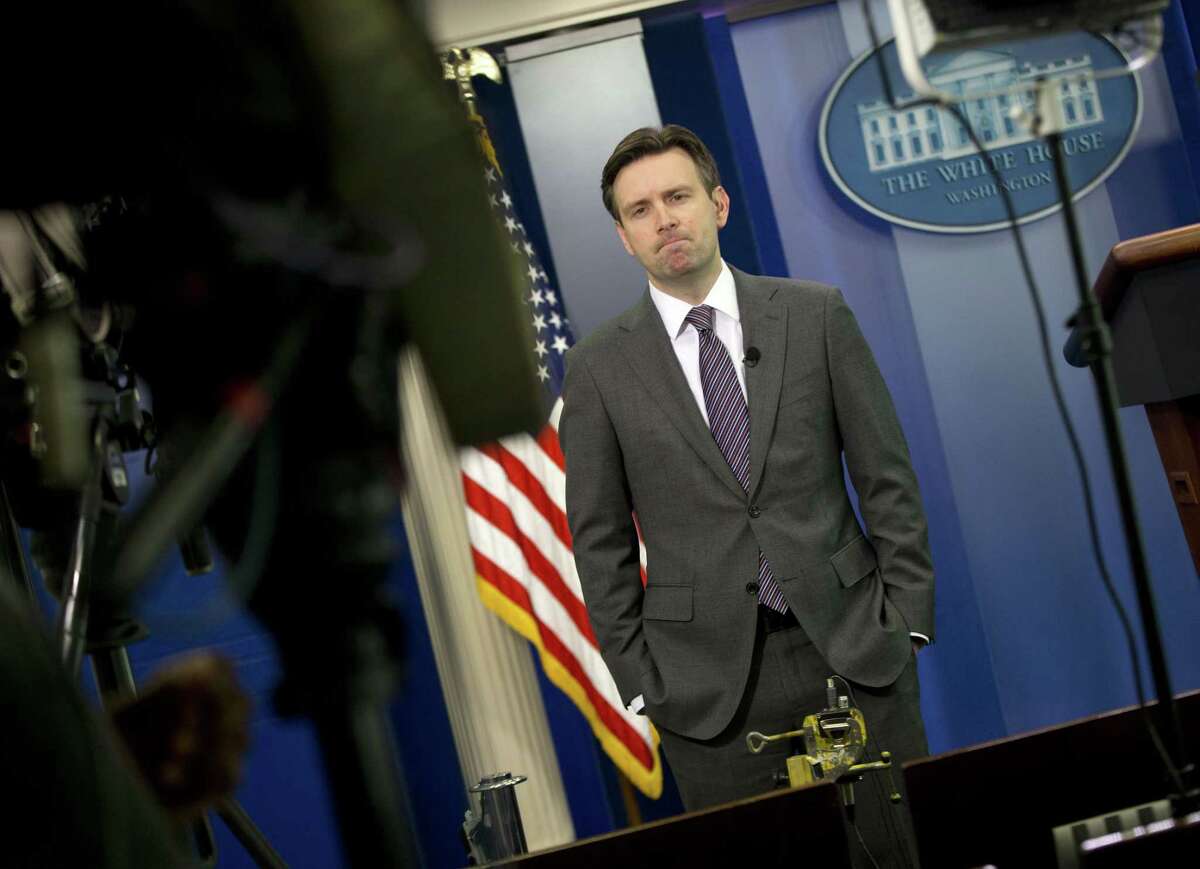 White House press secretary Josh Earnest waits to do a television interview with Fox News in the Brady Press Briefing Room of the White House in Washington, Wednesday, Jan. 7, 2015. President Barack Obama has condemned the shooting at the offices of Charlie Hebdo in Paris that has reportedly killed 12 people.