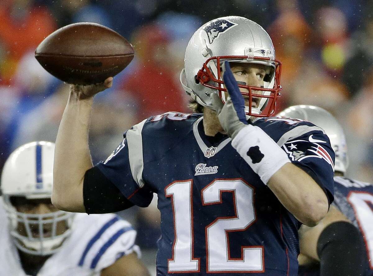 In this Jan. 18, 2015 photo, New England Patriots quarterback Tom Brady looks to pass during the first half of the NFL football AFC Championship game against the Indianapolis Colts in Foxborough, Mass.
