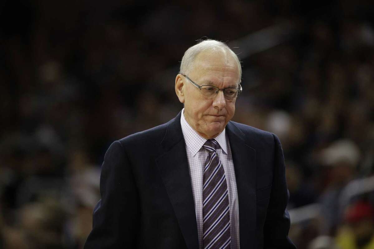 In this Dec. 20, 2014, file photo, Syracuse head coach Jim Boeheim reacts during an NCAA college basketball game against Villanova in Philadelphia. The NCAA has suspended Syracuse coach Jim Boeheim Friday, March 6, 2015, for nine games for academic, drug and gifts violations committed primarily by the men’s basketball program.