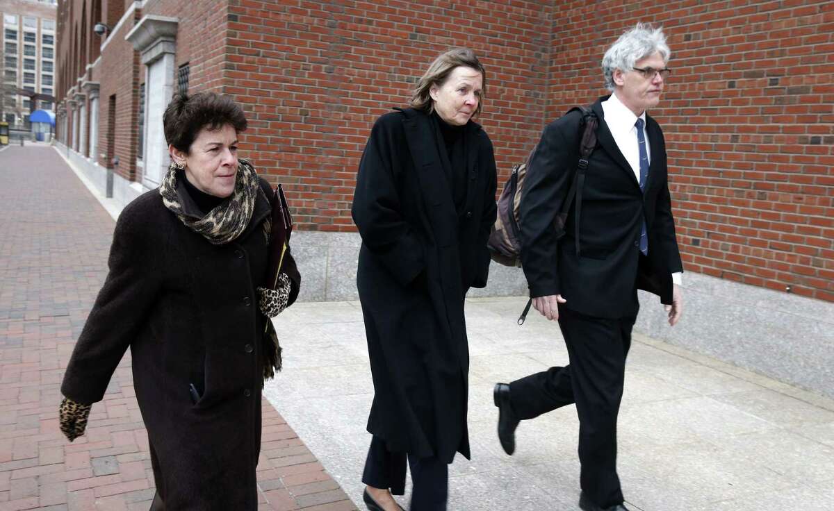 Members of the legal defense team for Boston Marathon bombing suspect Dzhokhar Tsarnaev, from left, Miriam Conrad, Judy Clarke and Timothy Watkins arrive at the federal courthouse in Boston,Tuesday, Jan. 6, 2015, on the second day of jury selection in Tsarnaev's trial. (AP Photo/Michael Dwyer)