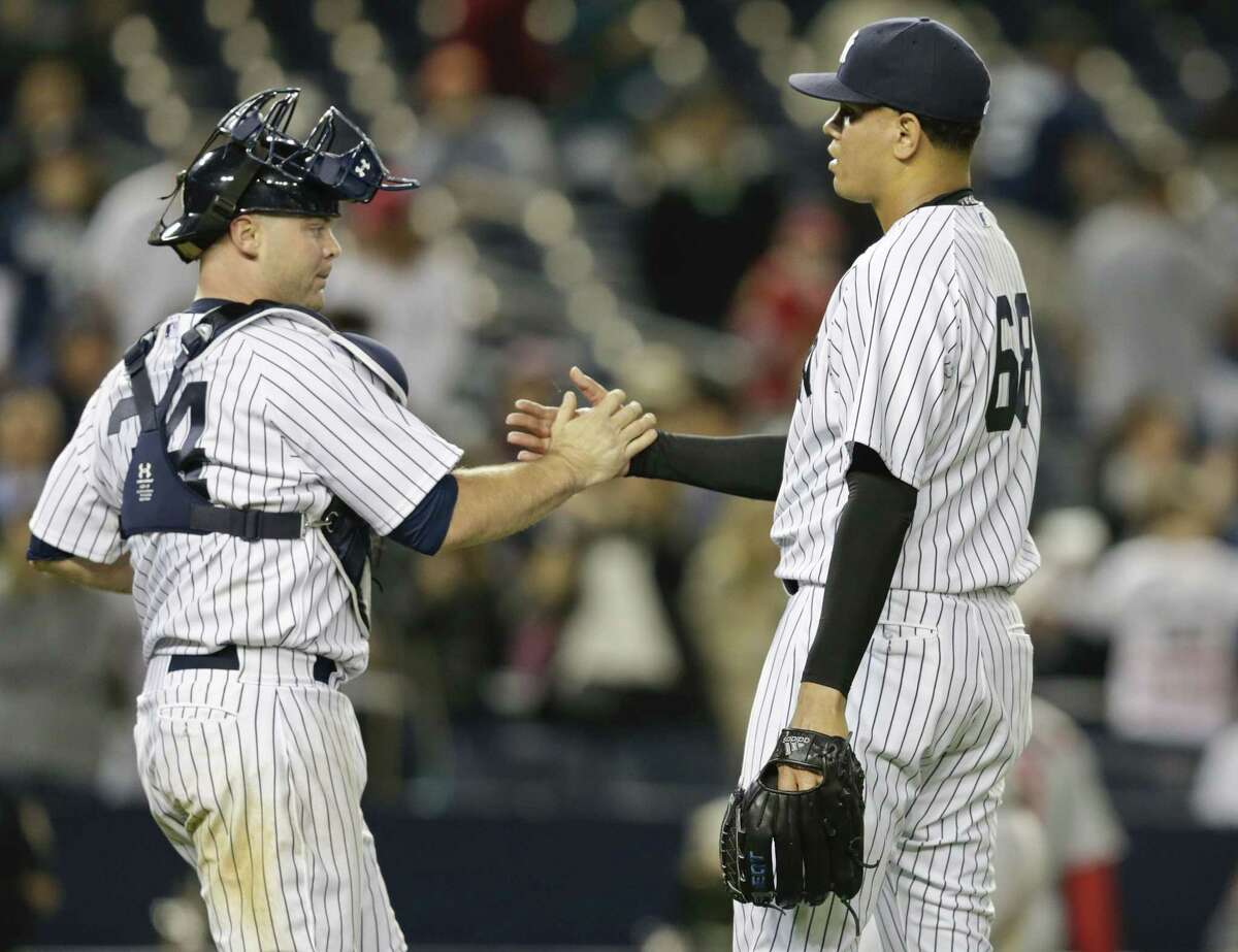 Yankees reliever Dellin Betances celebrates with catcher Brian McCann after Friday’s win over the Los Angeles Angels in New York.