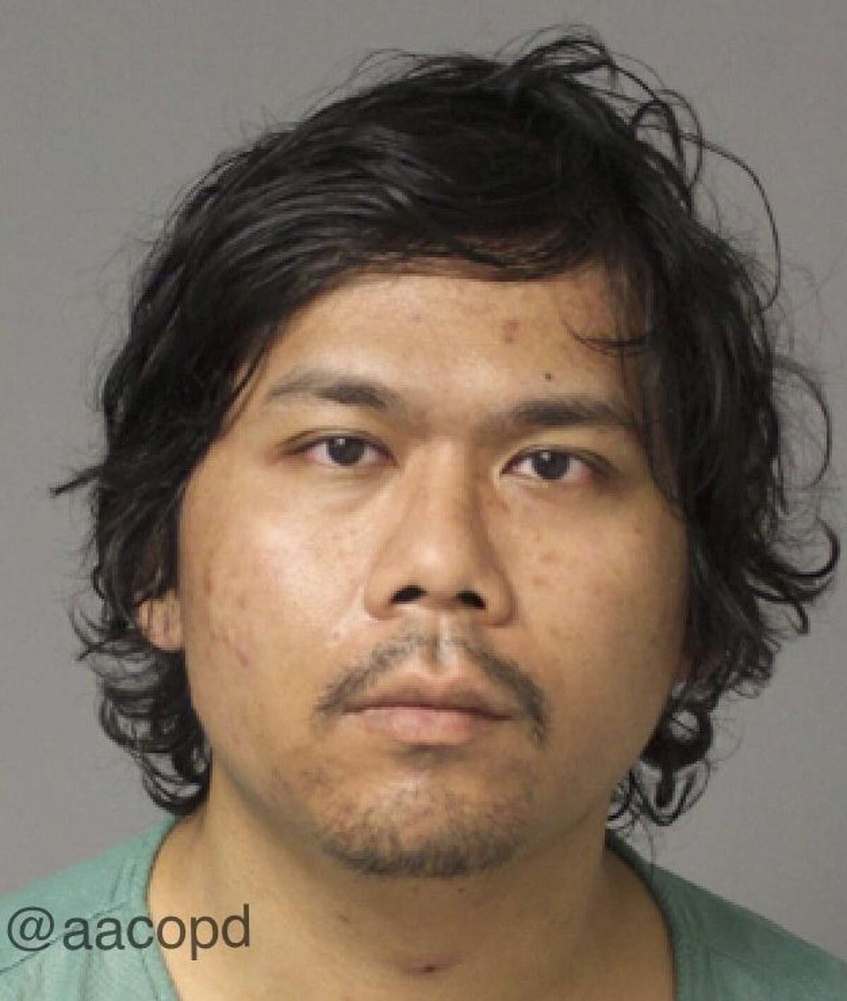 This undated image provided by the Anne Arundel County Police Department shows the booking photo of Hong Young. Young, accused of firing at five public places in Maryland, including a building at the National Security Agency, chose his targets at random, police said Wednesday, March 4, 2015. Young was charged with attempted murder and assault in the first shooting Feb. 24 near a mall. Police said the other shootings were linked by ballistic evidence or surveillance video. (AP Photo/Anne Arundel County Police Department)