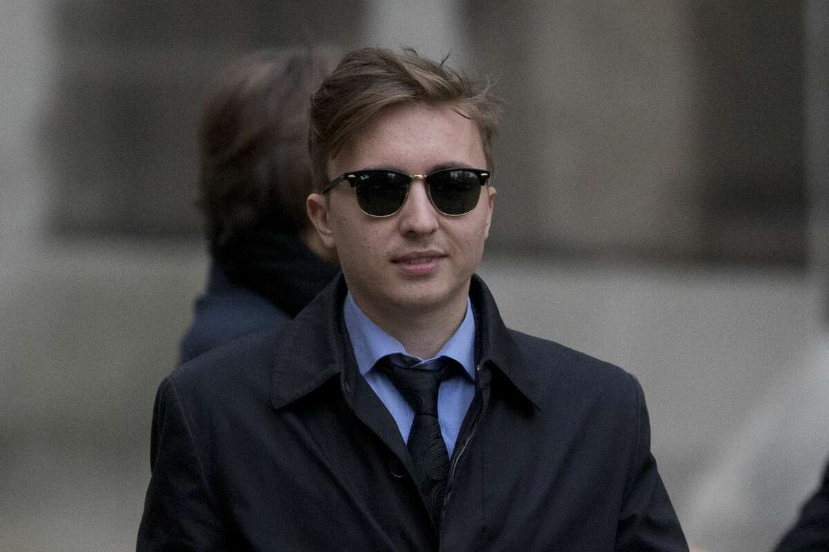 Anatoly Litvinenko, the son of former Russian intelligence officer Alexander Litvinenko, leaves after his mother Marina testified at the inquiry into her husband's death at the Royal Courts of Justice in London, Monday, Feb. 2, 2015. The widow of former KGB officer Alexander Litvinenko described him Monday as a loyal intelligence agent who grew disillusioned with Russia's 1990s war in Chechnya and what he saw as the country's corrupted security services. (AP Photo/Matt Dunham)