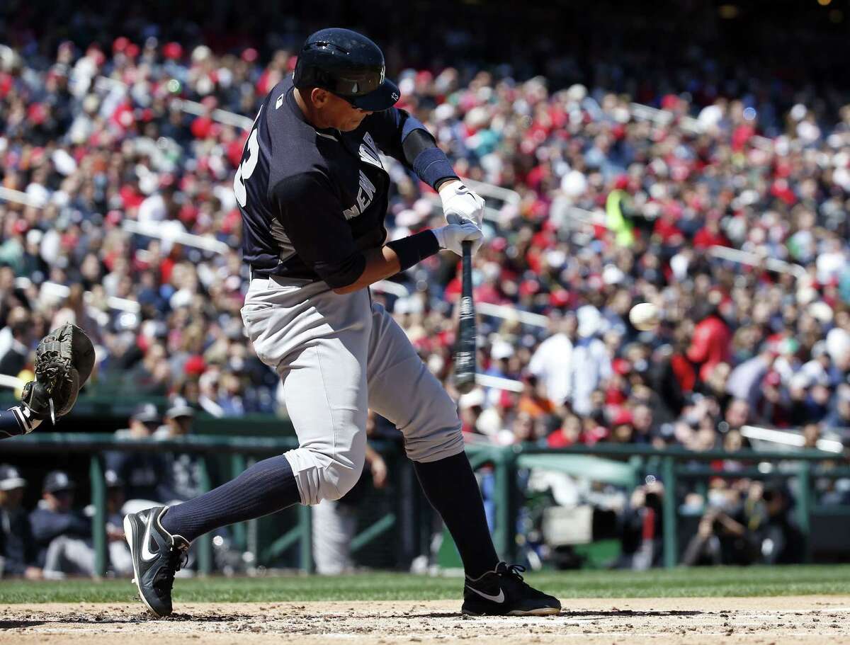 New York Yankees designated hitter Alex Rodriguez (13) fouls a ball away during the third inning of an exhibition baseball game against the Washington Nationals at Nationals Park, Saturday, April 4, 2015, in Washington. (AP Photo/Alex Brandon)