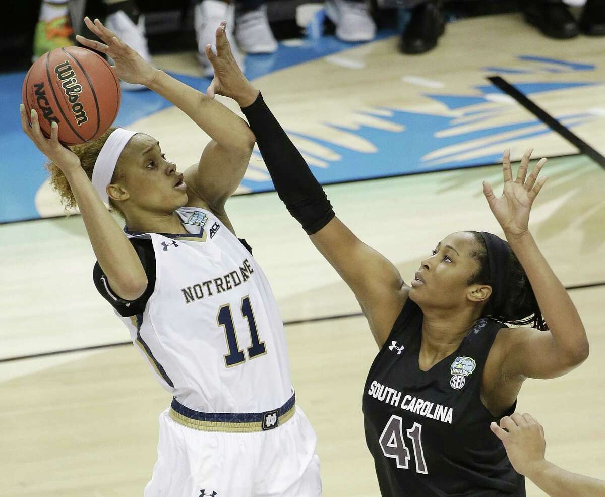 Notre Dame forward Brianna Turner (11) shoots against South Carolina center Alaina Coates (41) during the second half of the NCAA Women’s Final Four tournament college basketball semifinal game, Sunday, April 5, 2015, in Tampa, Fla. Notre Dame won 66-65.