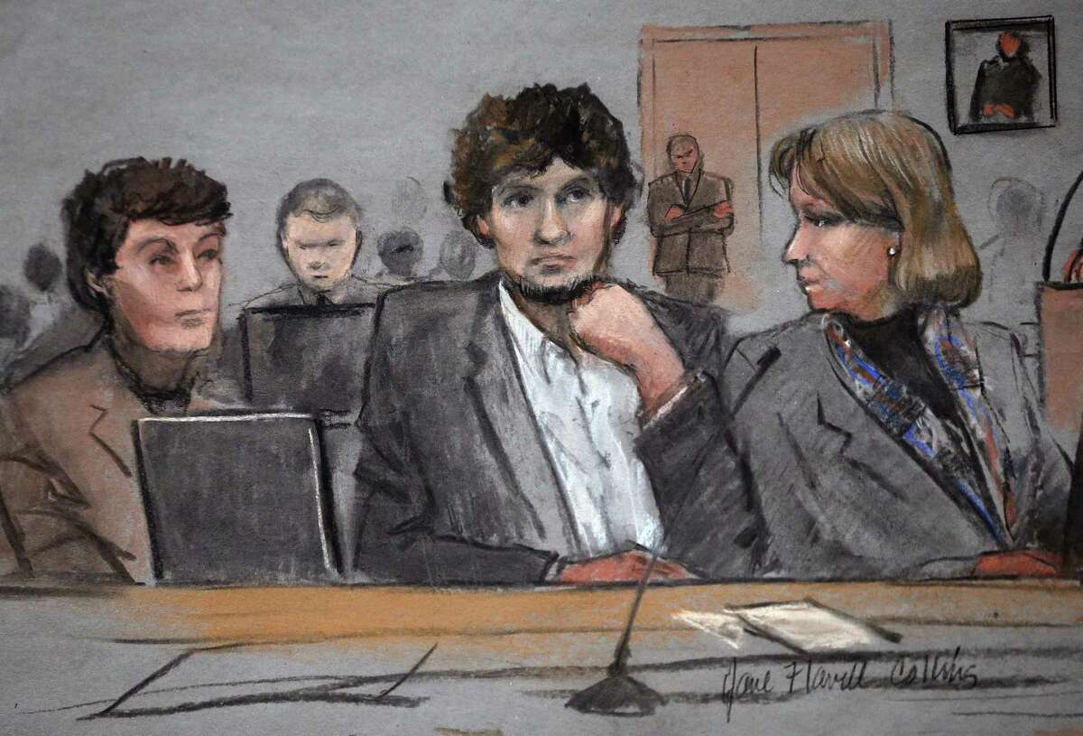 In this courtroom sketch, Dzhokhar Tsarnaev, center, is depicted between defense attorneys Miriam Conrad, left, and Judy Clarke, right, during his federal death penalty trial, Thursday, March 5, 2015, in Boston. Tsarnaev is charged with conspiring with his brother to place two bombs near the Boston Marathon finish line in April 2013, killing three and injuring 260 people. (AP Photo/Jane Flavell Collins)