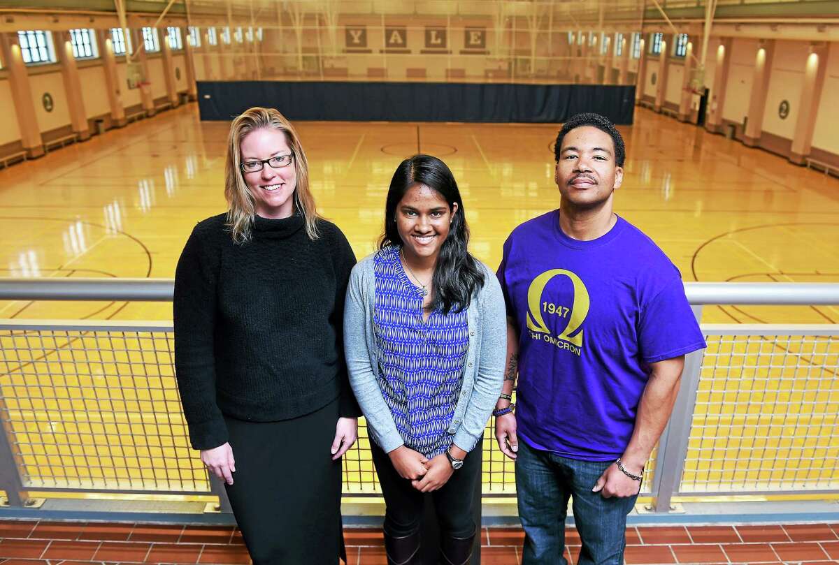 Left to right, Erika Ganley, Community Manager for the American Cancer Society’s Relay for Life, Samantha Nanayakkara, student co-chairman of the planning committee, and participant Aurelious Woolfolk, Jr., of the Chi Omicron Chapter of Omega Psi Phi Fraternity are photographed at the Lanman Center at Yale University on 3/30/2015.