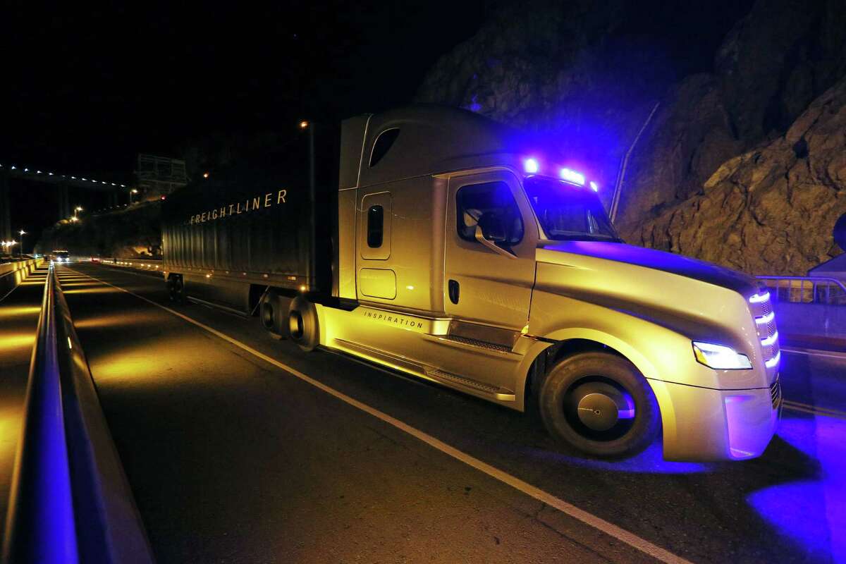 Freightliner unveils its Inspiration self-driving truck during an event at the Hoover Dam Tuesday, May 5, 2015, near Boulder City, Nev. (AP Photo/John Locher)