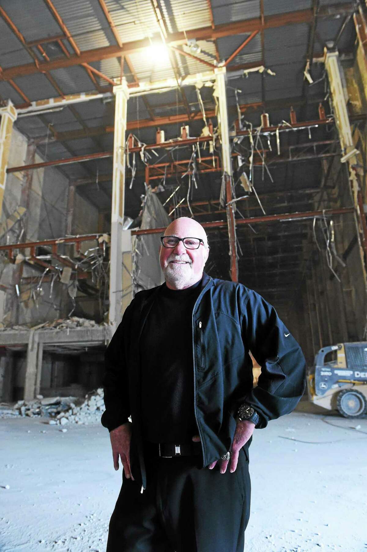 Eliot Tatelman, president and CEO of Jordan’s Furniture, poses for a portrait in what used to be the New Haven Register pressroom after a ground-breaking ceremony Wednesday for the new furniture store at the Register’s former Sargent Drive building.
