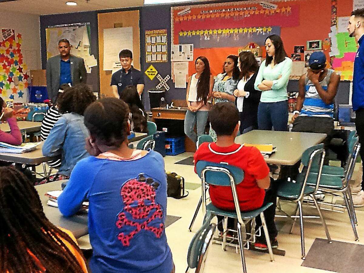 University of New Haven business students mentor Barnard Magnet Middle School students.