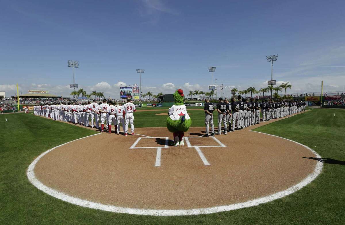 The Philadelphia Phillies’ mascot stands at home plate during the national anthem before a spring training game against the New York Yankees on Tuesday in Clearwater, Fla.