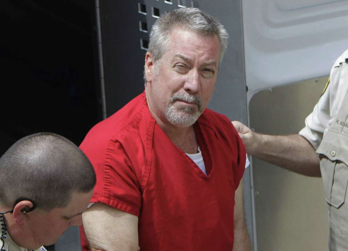 FILE - In this May 8, 2009 file photo, former Bolingbrook, Ill., police sergeant Drew Peterson arrives at the Will County Courthouse in Joliet, Ill., for his arraignment on charges of first-degree murder in the 2004 death of his third wife. On Tuesday, March 3, 2015, Peterson is expected in court at the Randolph Couty Courthouse in Chester, Ill., for a preliminary hearing on charges that he tried to hire someone to kill the Will County prosecutor who helped put him in state prison. (AP Photo/M. Spencer Green, File)