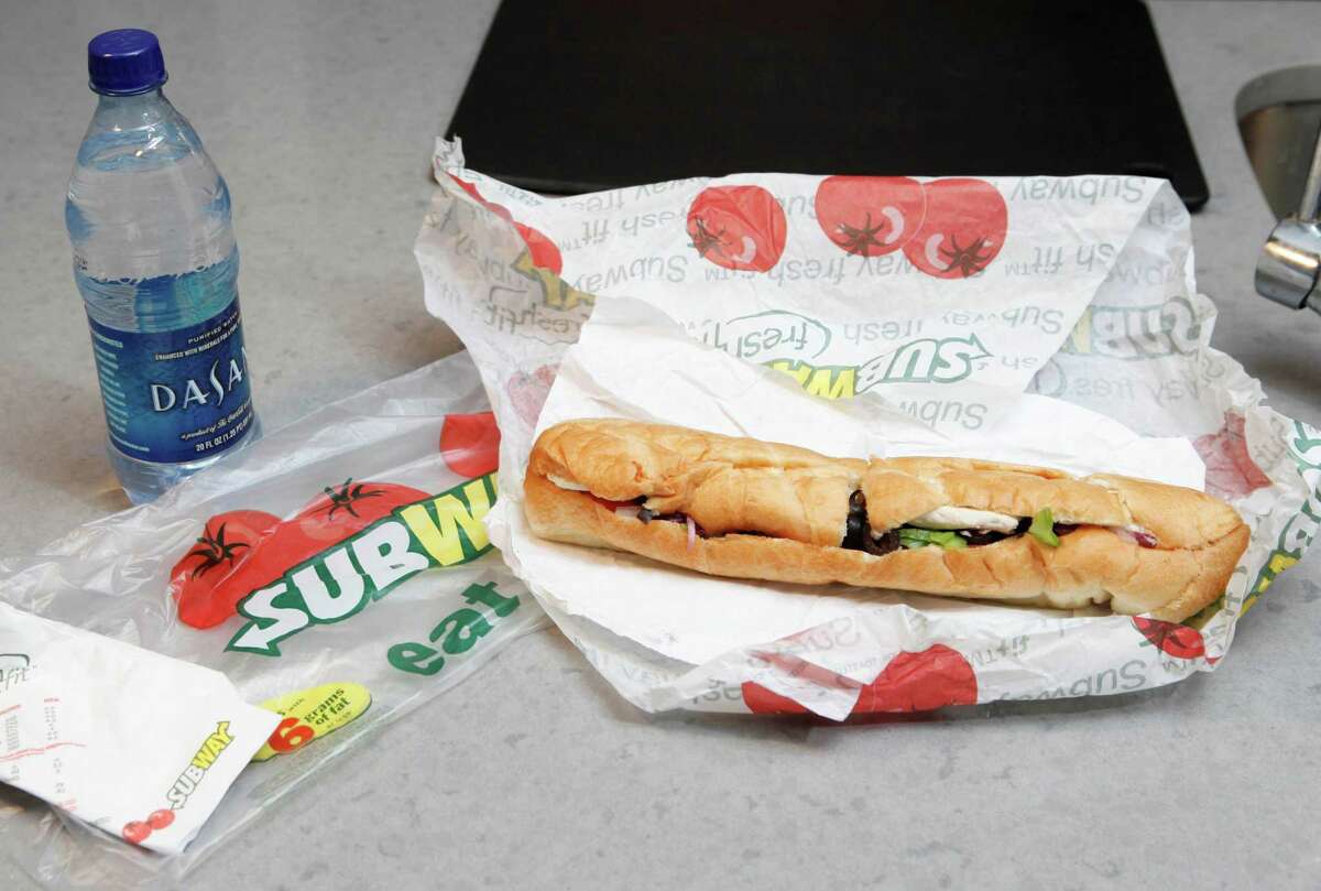 A chicken breast sandwich and water from Subway. The company announced June 4, 2015 that it will drop artificial flavors, colors and preservatives from its menu in North America by 2017.